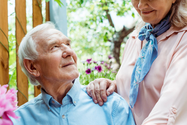 cropped view of cheerful retired woman standing near happy senior husband  - Photo, Image