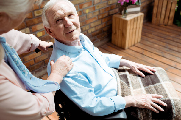 selective focus of senior disabled man looking at wife  - Fotoğraf, Görsel