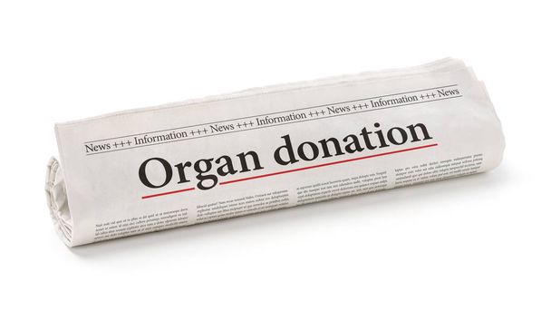 Periódico enrollado con el titular Donación de órganos
 - Foto, imagen