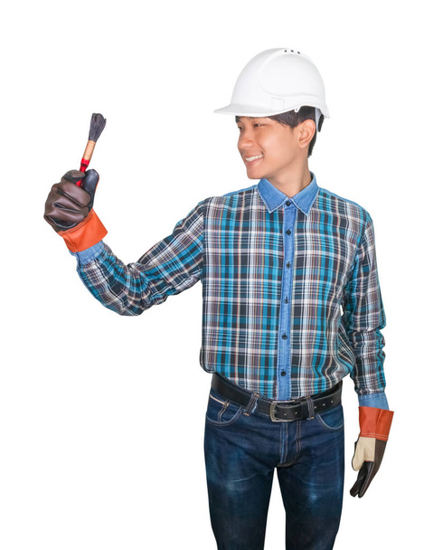 hand of engineer holding paint brush white background - Foto, imagen