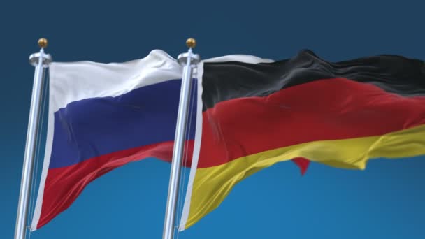 4k zökkenőmentes Németország és Oroszország zászlók kék ég háttér, GER de RUS ru. - Felvétel, videó
