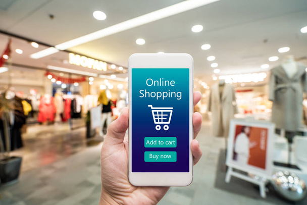 Smart phone online shopping in woman hand. Shopping center in ba - Foto, Bild