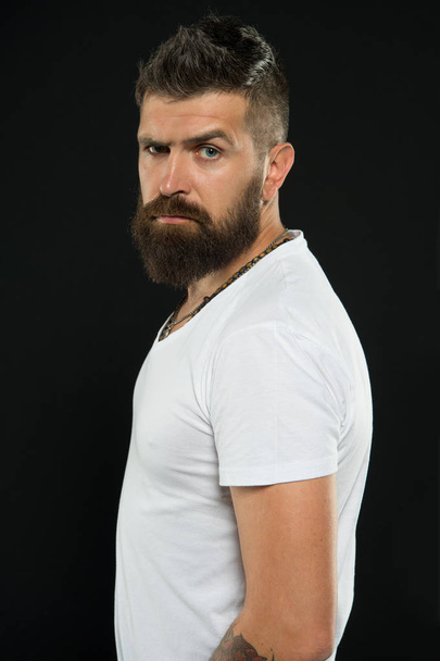 Man handsome hipster stylish beard and mustache. Styling and trimming beard care. Beauty and masculinity. Bearded confident hipster. Beard fashion and barber concept. Barber tips maintain beard - Photo, Image
