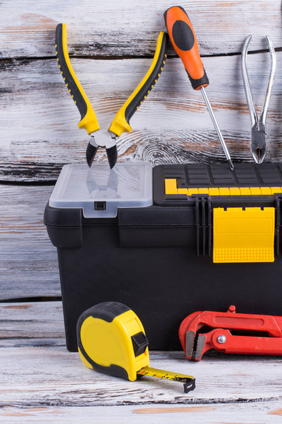 Tool box with different tools on wooden background. - Фото, изображение