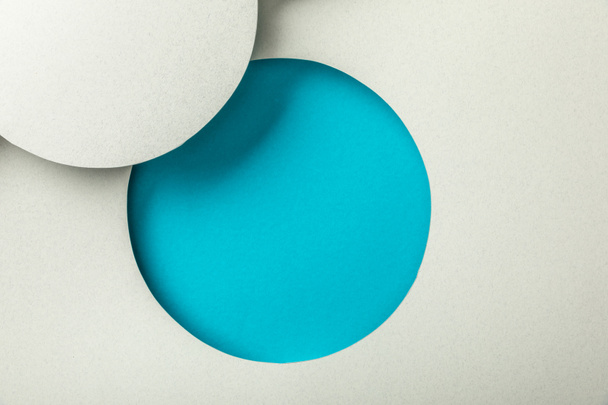 creative background with white paper and blue hole - Foto, afbeelding