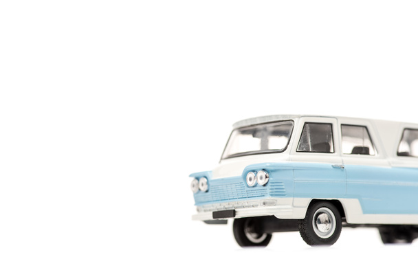 blue toy car on white with copy space - Foto, afbeelding