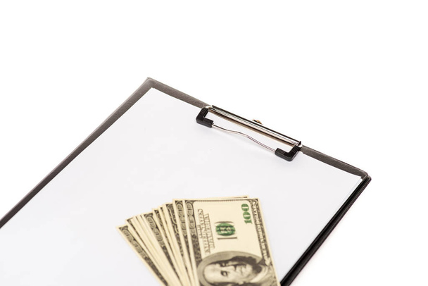 dollar banknotes and empty clipboard isolated on white - 写真・画像
