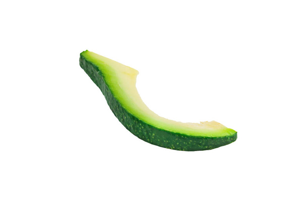 One piece of green fresh raw avocado without kernel isolated on white background. Clipping Path - Photo, image