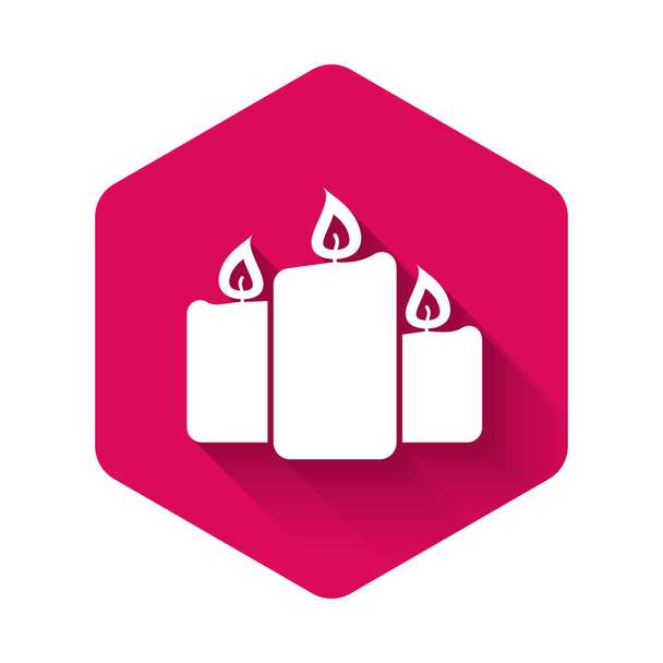 White Burning candles icon isolated with long shadow. Old fashioned lit candles. Cylindrical aromatic candle sticks with burning flames. Pink hexagon button. Vector Illustration - Vector, Image