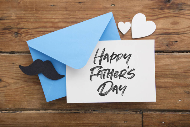 Happy Fathers day card and envelope with mustache and love hearts - Фото, изображение