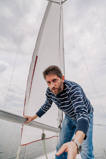 Portrait of  yacht captain against  sail - Fotoğraf, Görsel