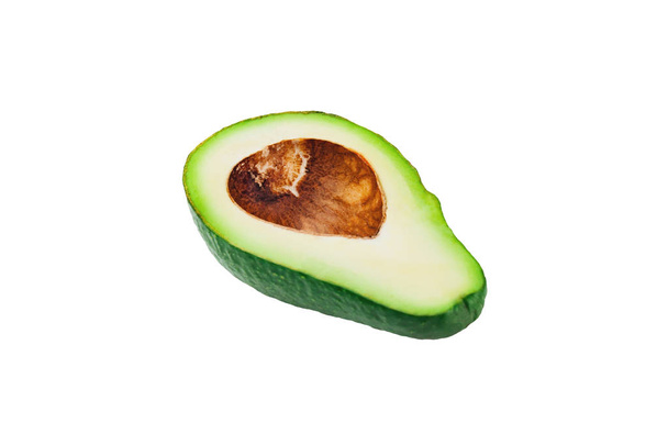 One half of green fresh raw avocado without kernel isolated on white background. Clipping Path - Valokuva, kuva