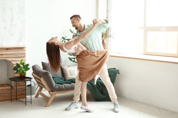 Dancing young couple at home - Φωτογραφία, εικόνα