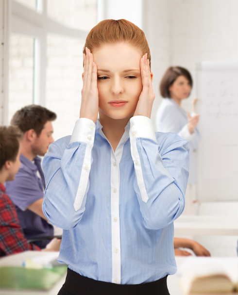Girl with headache at school - Photo, Image