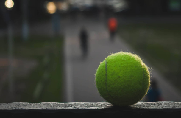 tennis ball lying on a metal stand - Photo, Image