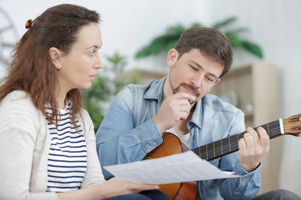 man playing guitar with a friend - Foto, Imagen
