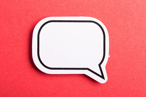 Speech Bubble Isolated On Red Background - Foto, afbeelding