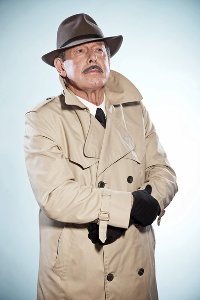 Vintage detective man with mustache and hat. Wearing raincoat. S - Zdjęcie, obraz