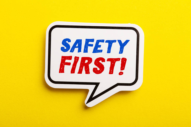 Safety First Concept Speech Bubble Isolated On Yellow - Photo, Image