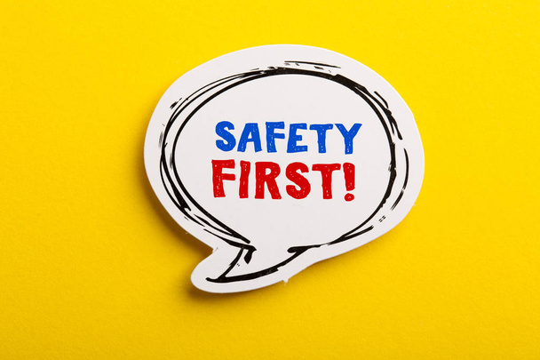 Safety First Concept Speech Bubble Isolated On Yellow - Photo, Image