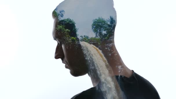 Double exposure of pensive man and beautiful tropical waterfall. Concept of traveling. - Footage, Video