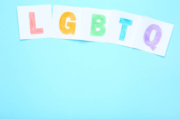 Paper with abbreviation LGBT on blue background - Foto, imagen