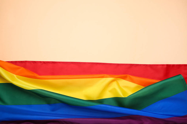 Rainbow flag on beige background - Foto, Imagen