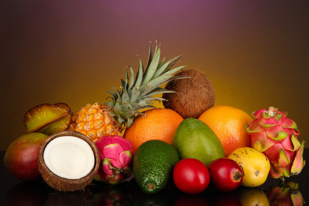 Composition of exotic fruits on colorful background - Valokuva, kuva