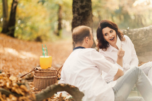 Romantic young couple walking in autumn park. Family together in the park. Pregnant couple. - Foto, Imagem