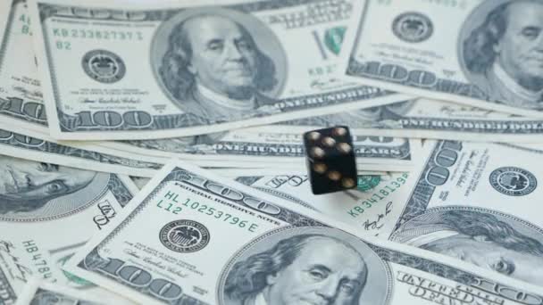 Slow motion two black dice, craps, thrown on dollars background,. Concept of gambling. - Footage, Video