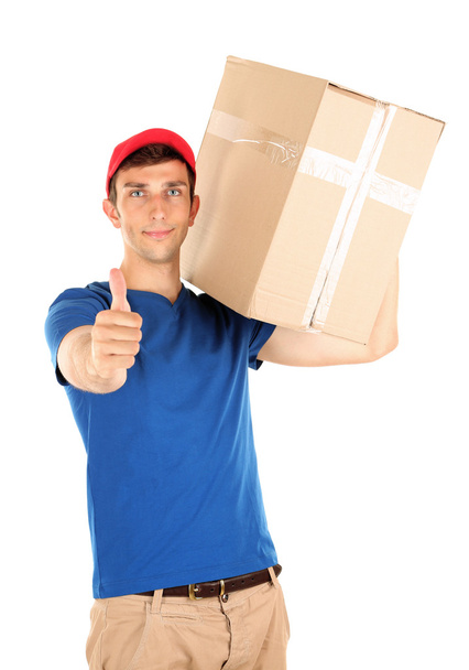 Young delivery man holding parcel, isolated on white - Фото, зображення