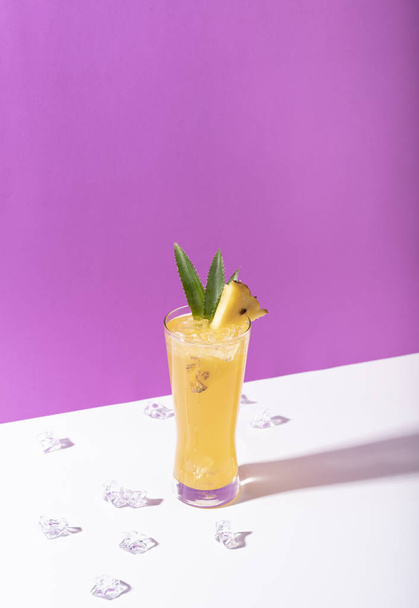 iced pineapple punch cocktail in glass on color background.  - Fotografie, Obrázek