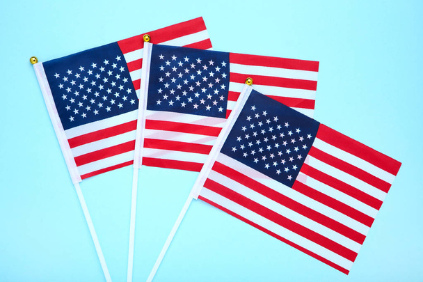 American flags on blue background - Фото, изображение