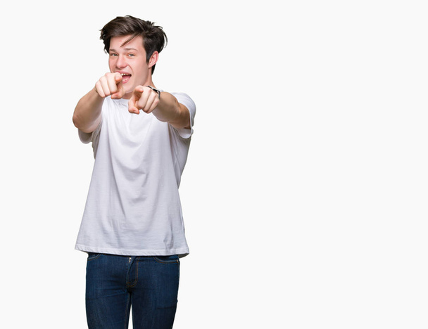 Young handsome man wearing casual white t-shirt over isolated background Pointing to you and the camera with fingers, smiling positive and cheerful - Photo, Image