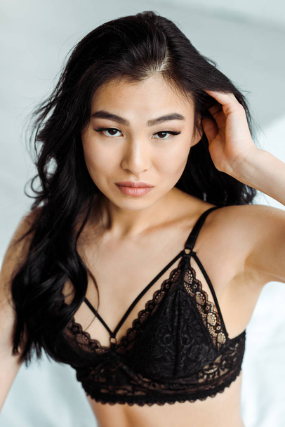sexy brunette thai woman in lace black bra looking at camera - Foto, immagini