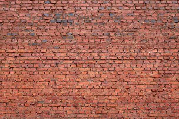 Image of old red brick wall with texture background, copy space for advertisment or promotion text, wide panorama of masonry, vintage house facade with ruined elements, may use to interior designer. - Photo, Image