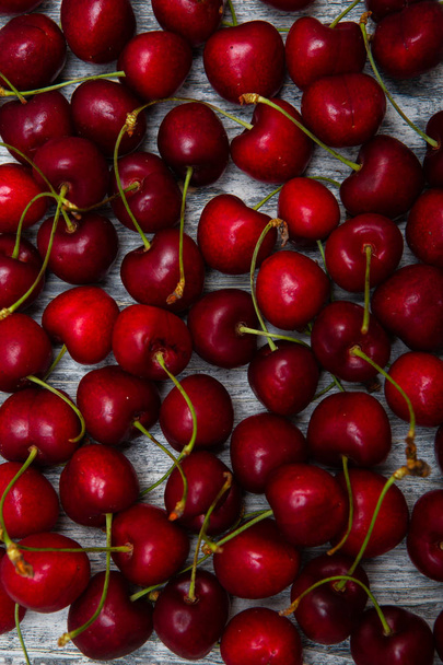 cherry on a wooden background close-up - Φωτογραφία, εικόνα