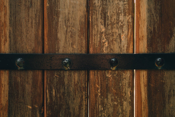 Dark Brown vintage wood vertical texture with metal plank background - Фото, изображение