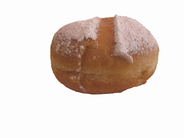 Single Krapfen ( italian doughnut ) covered with icing sugar on white background - Photo, Image