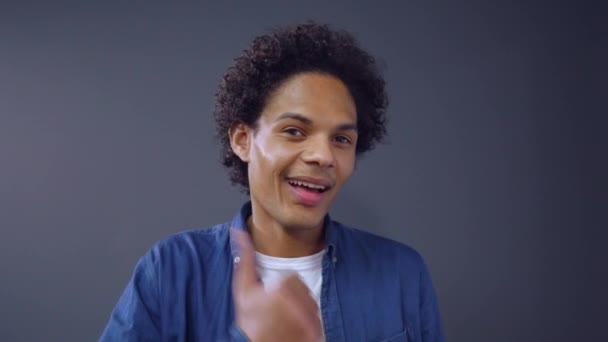 Curly Afro-american Guy Showing Thumb Up on Studio Background. - Video