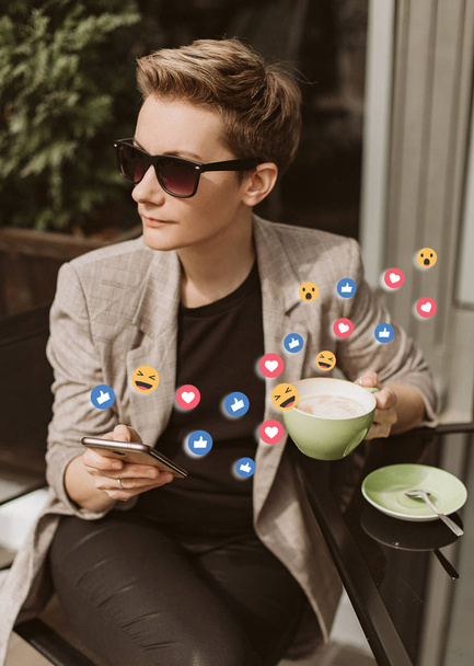 woman cafe smartphone symbols like super smile - Фото, изображение