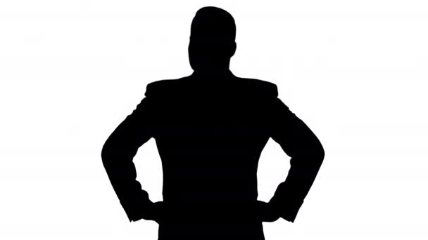 Silhouette Businessman looking around with hands on hips. - Footage, Video