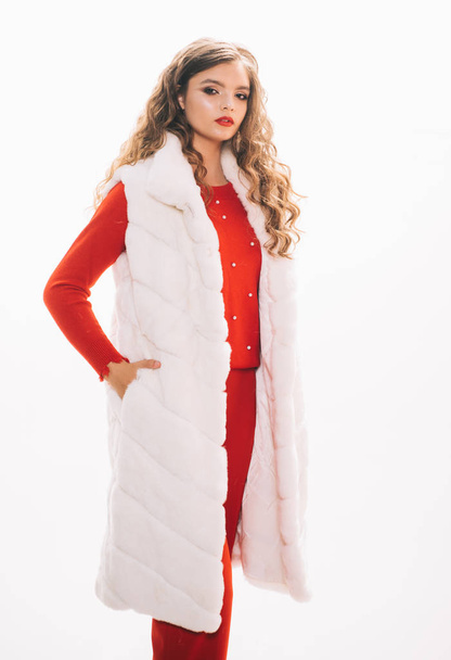 Looking expensive. Fashion model wear luxurious fur. Pretty woman in luxury fur vest. Winter fashion trend. Young woman wear elegant garment. Fashionable winter wardrobe. Perfect for cold weather - Foto, afbeelding