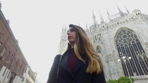 Young woman portrait walking outdoors in Milan. Lifestyle concep - Кадры, видео