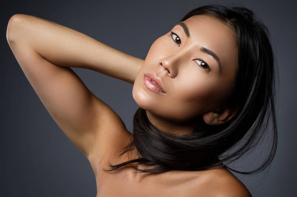 Beautiful asian woman with a black healthy hair - Photo, image