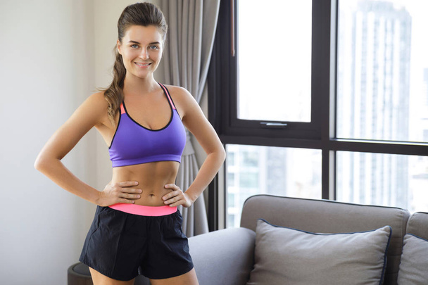 Happy woman is ready for home workout - Photo, image