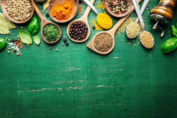 Spices and herbs on wooden background - Foto, imagen