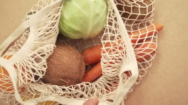 Recycling mesh string bag full of vegetables and fruits, eco frindly no plastic concept 4k - Záběry, video