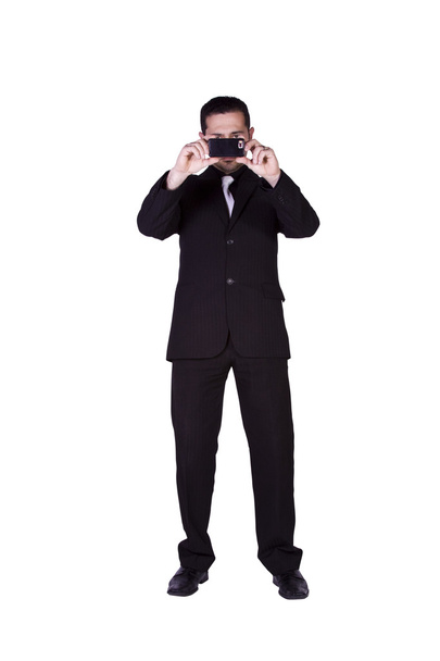Businessman taking a picture with phone - Foto, imagen