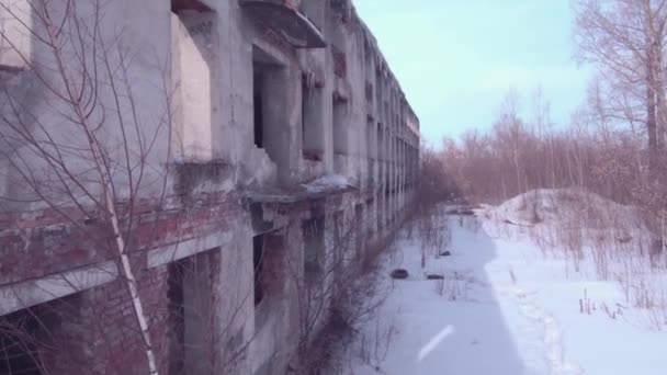 Flight over the abandoned building, Old destroyed building in a winter season. Aerial view 4K - Imágenes, Vídeo